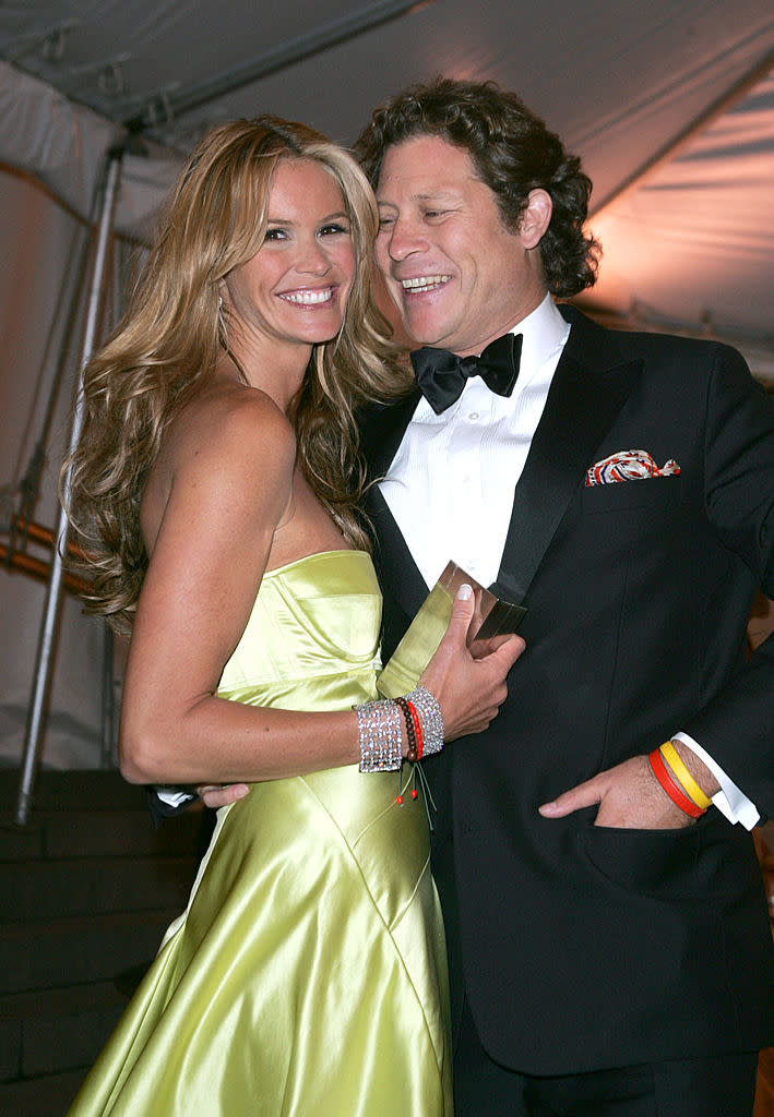 Elle and Arpad smiling and embracing, man in tuxedo and woman in satin gown