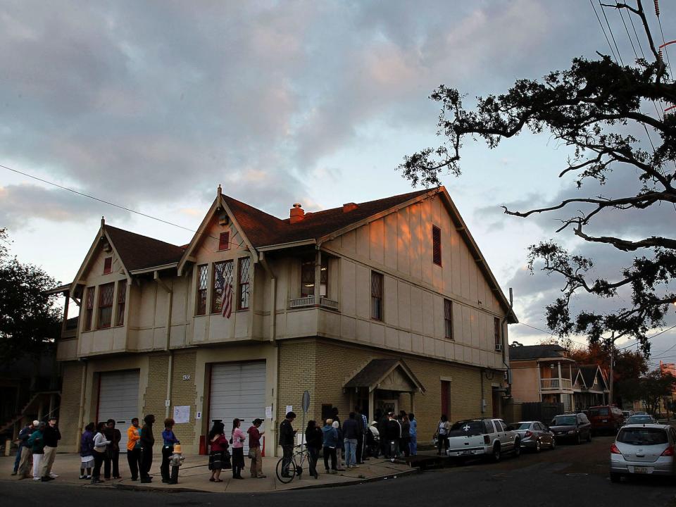 Voters line up at the Engine 26 Ladder 9 firehouse to cast their vote in New Orleans, Louisiana.