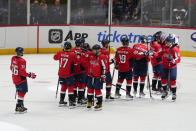 Washington Capitals players react at the enof of an NHL hockey game against the New York Rangers, Saturday, Feb. 25, 2023, in Washington. The Capitals won 6-3. (AP Photo/Julio Cortez)