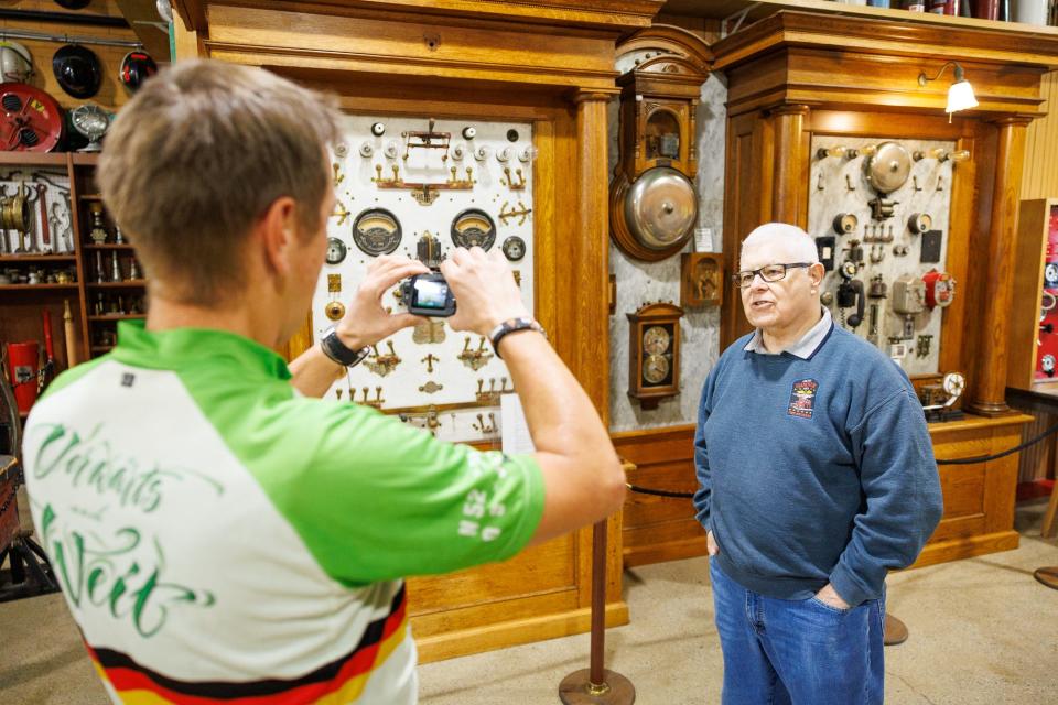 Andreas Beneke, from Hannover, Germany, films a tour with retired Hanover Fire Commissioner James Roth as Beneke visits the Greater Hanover Area Fire Museum while on a bicycle trip around the world, Friday, April 19, 2024, in Hanover Borough.