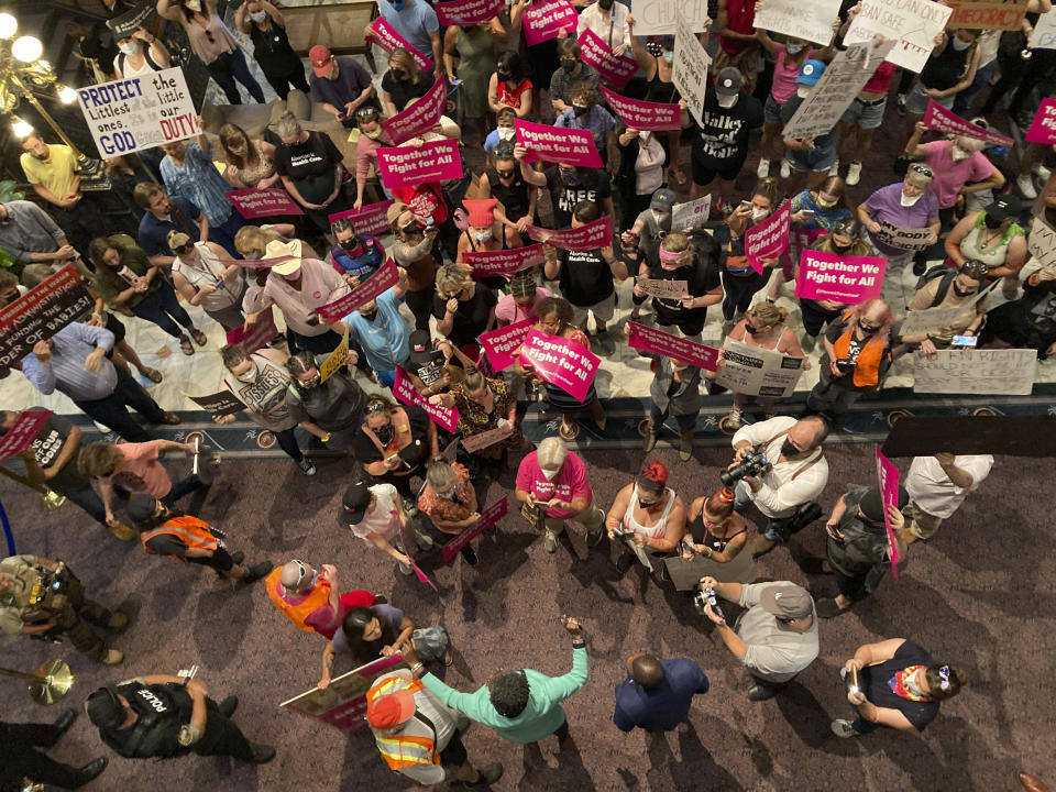 South Carolina House Rep. Gilda Cobb-Hunter, D-Orangeburg, is confronted by protesters who support more abortion restrictions as she speaks to protestors upset at the recent U.S. Supreme Court ruling removing protections for abortions on Tuesday, June 28, 2022, in Columbia South Carolina. (AP Photo/Jeffrey Collins)