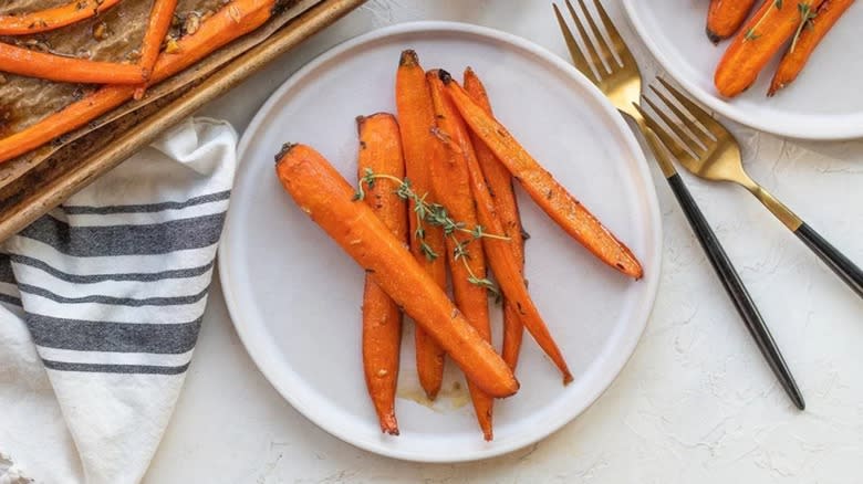 Plate of roasted carrots cut lengthwise