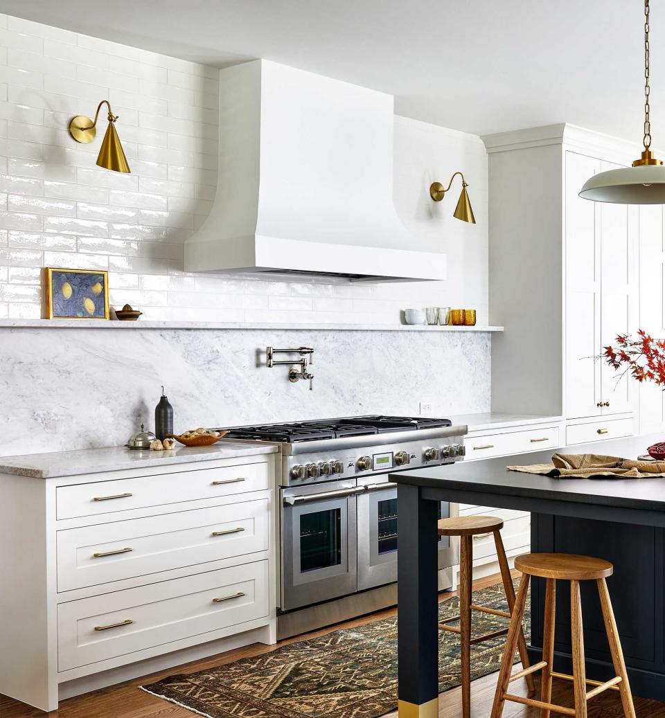 a modern kitchen with an island and extractor