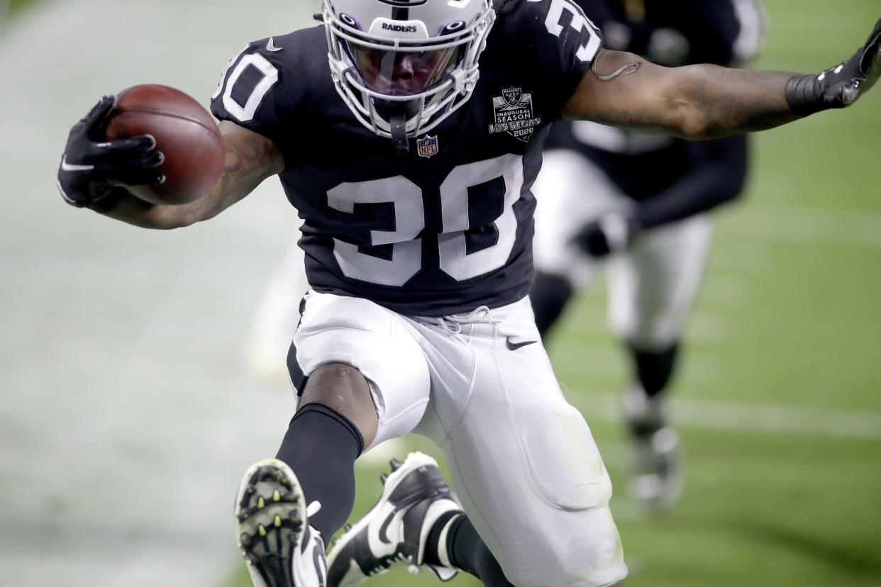 Las Vegas Raiders running back Jalen Richard (30) scores a touchdown against the New Orleans Saints. (AP Photo/Isaac Brekken)