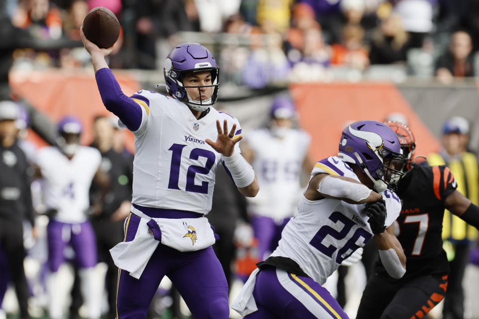 Minnesota Vikings quarterback Nick Mullens (12) throws a pass during the first half of an NFL football game against the Cincinnati Bengals, Saturday, Dec. 16, 2023, in Cincinnati. (AP Photo/Jay LaPrete)