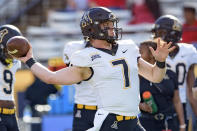 Appalachian State quarterback Chase Brice (7) warms up before the Sun Belt Conference championship NCAA college football game against Louisiana-Lafayette in Lafayette, La., Saturday, Dec. 4, 2021. (AP Photo/Matthew Hinton)