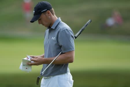 Jun 21, 2018; Cromwell, CT, USA; Jordan Spieth checks his note book on the 17th green during the first round of the Travelers Championship at TPC River Highlands. Mandatory Credit: Bill Streicher-USA TODAY Sports