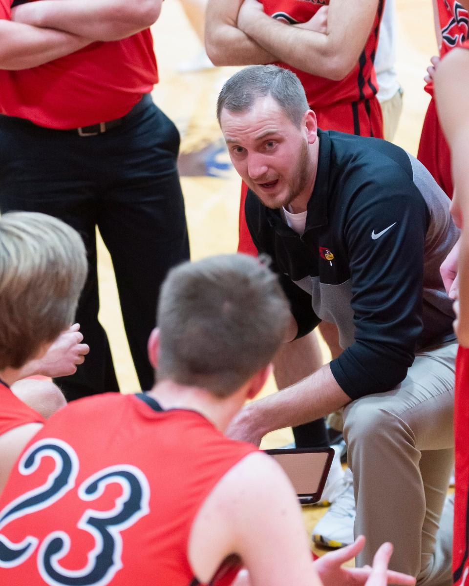 Ell-Saline head coach Marty Wendel instructs his players during a timeout during a game in 2021.