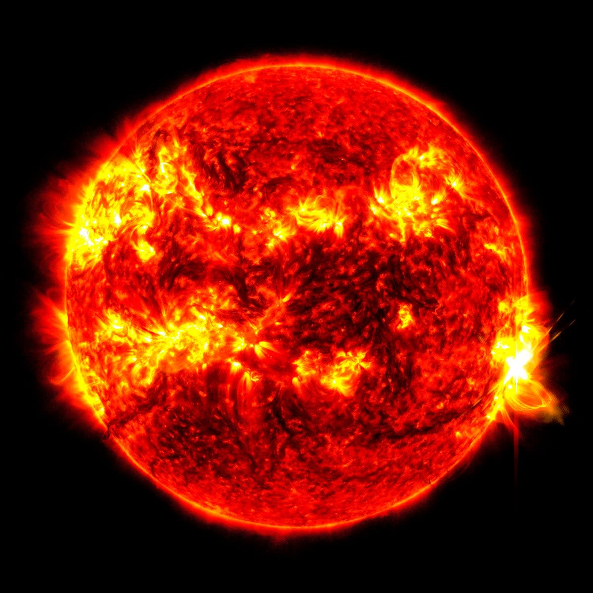 This image provided by NASA's Solar Dynamics Observatory shows a solar flare, the bright flash at right, on Tuesday, May 14, 2024 (AP)