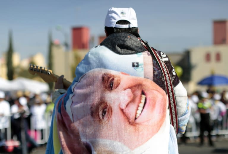 Catholic faithful attend an open-air mass by Pope Francis in Ecatepec on February 14, 2016