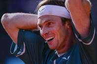 Andrey Rublev, of Russia, reacts during a match against Taylor Fritz, of United States, at the Mutua Madrid Open tennis tournament in Madrid, Spain, Friday, May 3, 2024. (AP Photo/Bernat Armangue)
