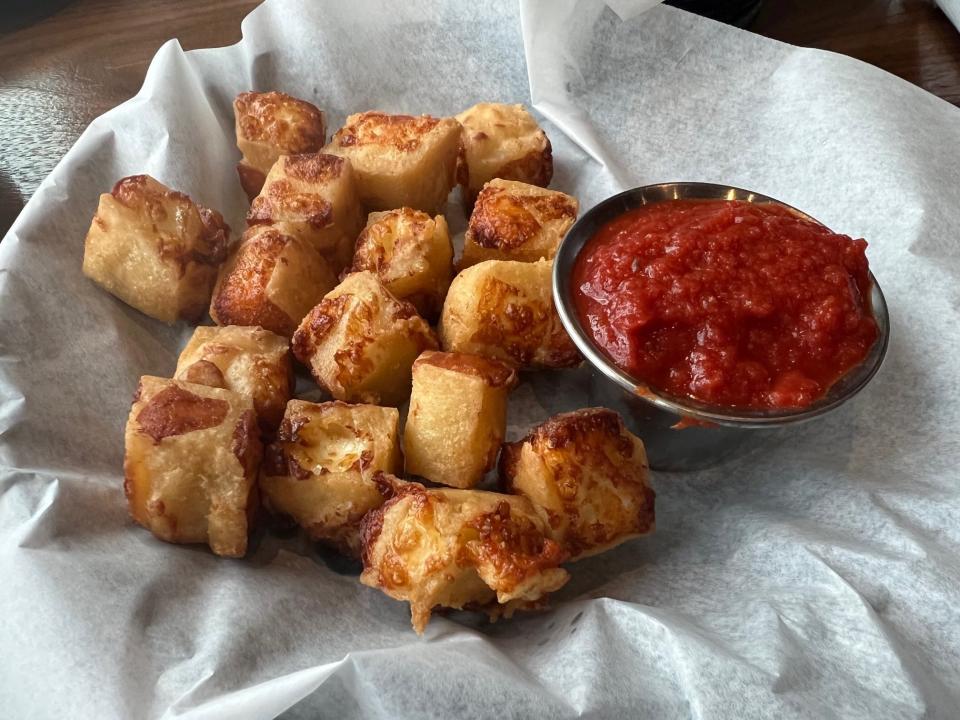 The cheese curds at Bix & Co. use Wisconsin white cheddar cheese in a crispy beer batter.