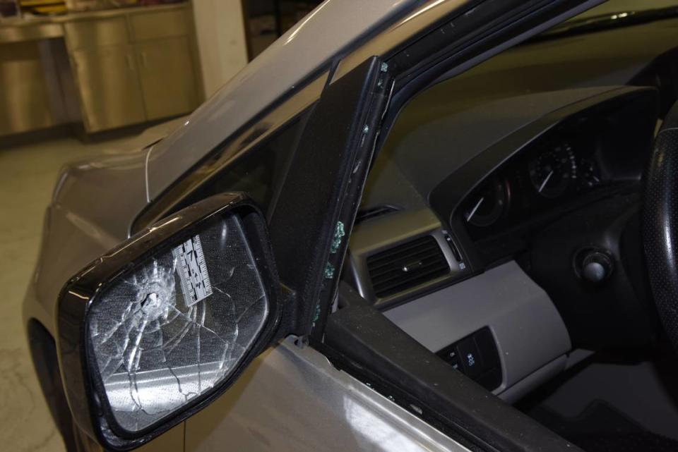 An evidence photo from the 2018 police shooting of John Albers in Overland Park shows a rear view mirror on the van Albers was driving shattered by a bullet fired by Overland Park police officer Clayton Jenison.