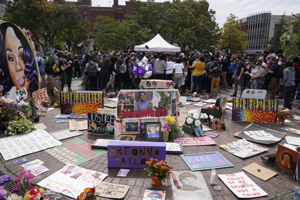 People gather in Jefferson Square awaiting word on charges against police officers, Wednesday, Sept. 23, 2020, in Louisville, Ky. A grand jury has indicted one officer on criminal charges six months after Breonna Taylor was fatally shot by police in Kentucky. The jury presented its decision against fired officer Brett Hankison Wednesday to a judge in Louisville, where the shooting took place. (AP Photo/Darron Cummings)