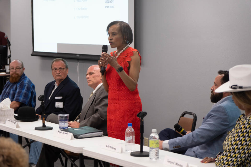 Mayoral candidate Freda Powell addresses the crowd as other candidates look on Thursday at the Amarillo League of Women Voters forum held at Amarillo College.
