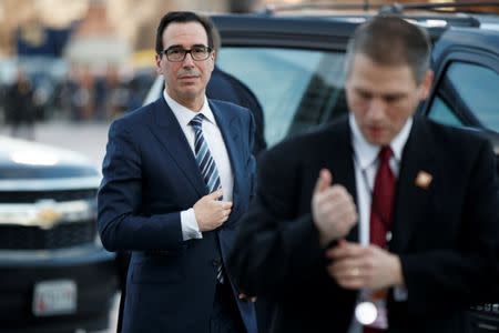 FILE PHOTO: US Secretary of Treasury Steven Mnuchin arrives at the US Capitol prior to the service for former President George H. W. Bush in Washington, DC, USA, 03 December 2018. Shawn Thew/Pool via REUTERS