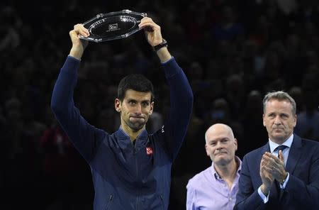 Tennis Britain - Barclays ATP World Tour Finals - O2 Arena, London - 20/11/16 Serbia's Novak Djokovic with the runners up trophy after losing the final against Great Britain's Andy Murray Reuters / Toby Melville Livepic