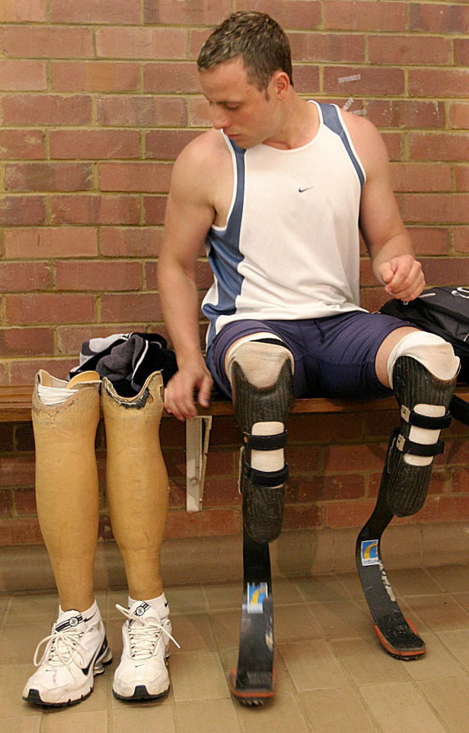 FILE : in this Thursday, June 21, 2007 file photo South African amputee champion sprinter, Oscar Pistorius, prior to a training session in Pretoria, South Africa. Born with a congenital condition, Pistorius had his lower legs amputated before he was a year old yet grew up to be an unlikely track athlete, an Olympic finalist and an international superstar who blurred the lines between able-bodied and disabled. Pistorius goes on trial Monday March 3, 2014 for the shooting death of his girlfriend Reeva Steenkamp. (AP Photo/Denis Farrell, File)