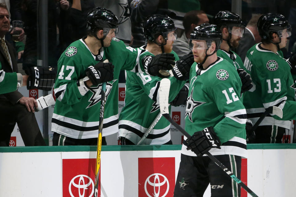 Dallas Stars center Radek Faksa (12) celebrates his goal against the Arizona Coyotes with right wing Alexander Radulov (47) during the second period of an NHL hockey game in Dallas, Wednesday, Feb. 19, 2019. (AP Photo/Michael Ainsworth)