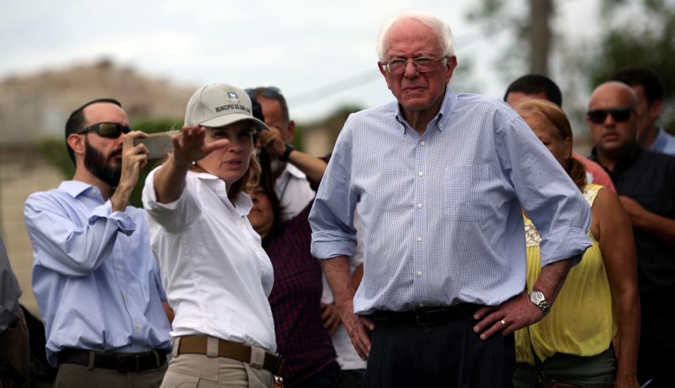 San Juan Mayor Carmen Yul&iacute;n Cruz shows Sen. Bernie Sanders (I-Vt.) the&nbsp; damage from Hurricane Maria during Sanders' visit to the island on Oct. 27. (Photo: Alvin Baez / Reuters)