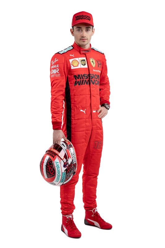 Ferrari's driver Charles Leclerc poses for a photo