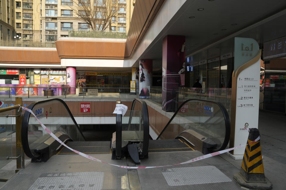 Escalators are blocked off at a partially shuttered Evergrande commercial complex in Beijing, Monday, Jan. 29, 2024. Chinese property developer China Evergrande Group on Monday was ordered to liquidate by a Hong Kong court, after the firm was unable to reach a restructuring deal with creditors. (AP Photo/Ng Han Guan)