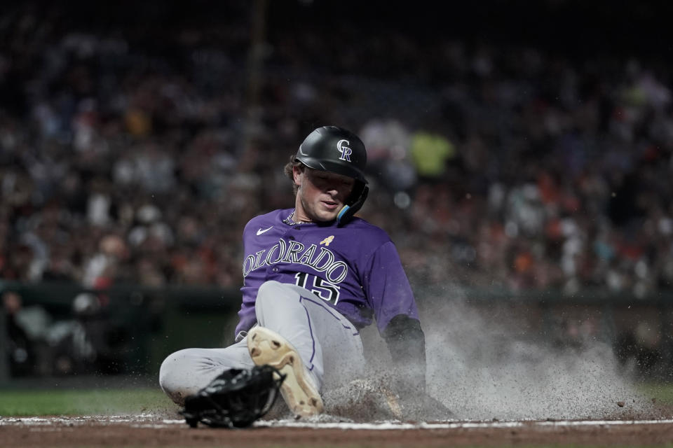 Colorado Rockies' Hunter Goodman scores against the San Francisco Giants on Sean Bouchard's single during the second inning of a baseball game Friday, Sept. 8, 2023, in San Francisco. (AP Photo/Godofredo A. Vásquez)