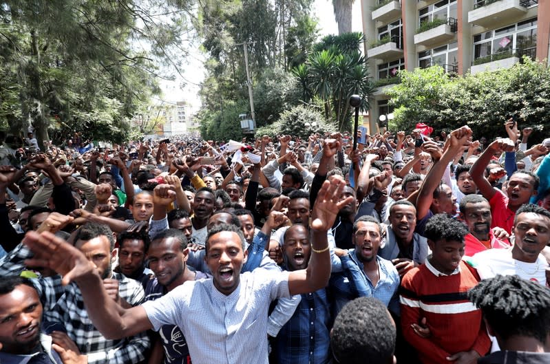 Oromo youth shout slogans outside Jawar Mohammed's house, an Oromo activist and leader of the Oromo protest in Addis Ababa