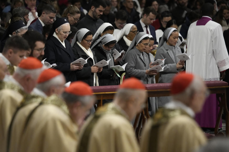 Nuns and cardinals attend Christmas eve Mass celebrated by Pope Francis, at St. Peter's Basilica at the Vatican, Sunday Dec. 24, 2023. (AP Photo/Gregorio Borgia)
