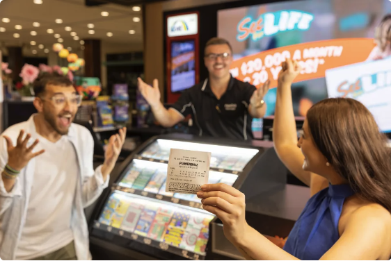 Stock image showing two people celebrating lottery win inside newsagent. 