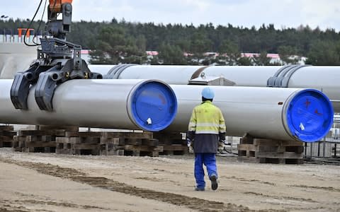 (FILES) In this file photo taken on March 26, 2019, a man works at the construction site of the Nord Stream 2 gas pipeline in Lubmin, northeastern Germany. - The German-Russian Chamber of Commerce on December 12, 2019 called for retaliatory sanctions after US lawmakers gave initial approval to a bill that would punish contractors working on a Russian pipeline to Germany. (Photo by Tobias SCHWARZ / AFP) (Photo by TOBIAS SCHWARZ/AFP via Getty Images) - Credit: TOBIAS SCHWARZ/AFP