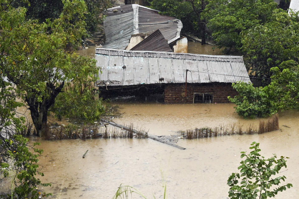 FILE - Houses are submerged in flood waters in Blantyre, Malawi, Tuesday, March 14, 2023. Much of the world takes daily weather forecasts for granted. But most of Africa's 1.3 billion people live with little advance knowledge of what's to come. That can be deadly, with damage running in the billions of dollars. The first Africa Climate Summit opens this week in Kenya to highlight the continent that will suffer the most from climate change while contributing to it the least. At the heart of every issue on the agenda, from energy to agriculture, is the lack of data collection that drives decisions as basic as when to plant and when to flee (AP Photo/Thoko Chikondi, File)