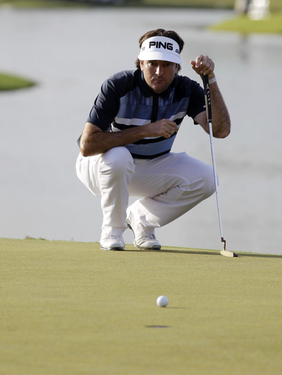 Bubba Watson looks at his shot on the 18th green during the final round of the Cadillac Championship golf tournament Sunday, March 9, 2014, in Doral, Fla. (AP Photo/Luis Alvarez)