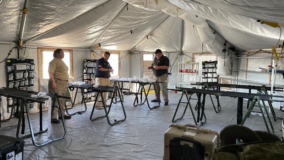 Medical professionals from Arkansas and Oklahoma are part of a Disaster Medical Assistance Team that has set up a tent hospital near the intersection of Sumter Boulevard and Tamiami Trail in North Port.