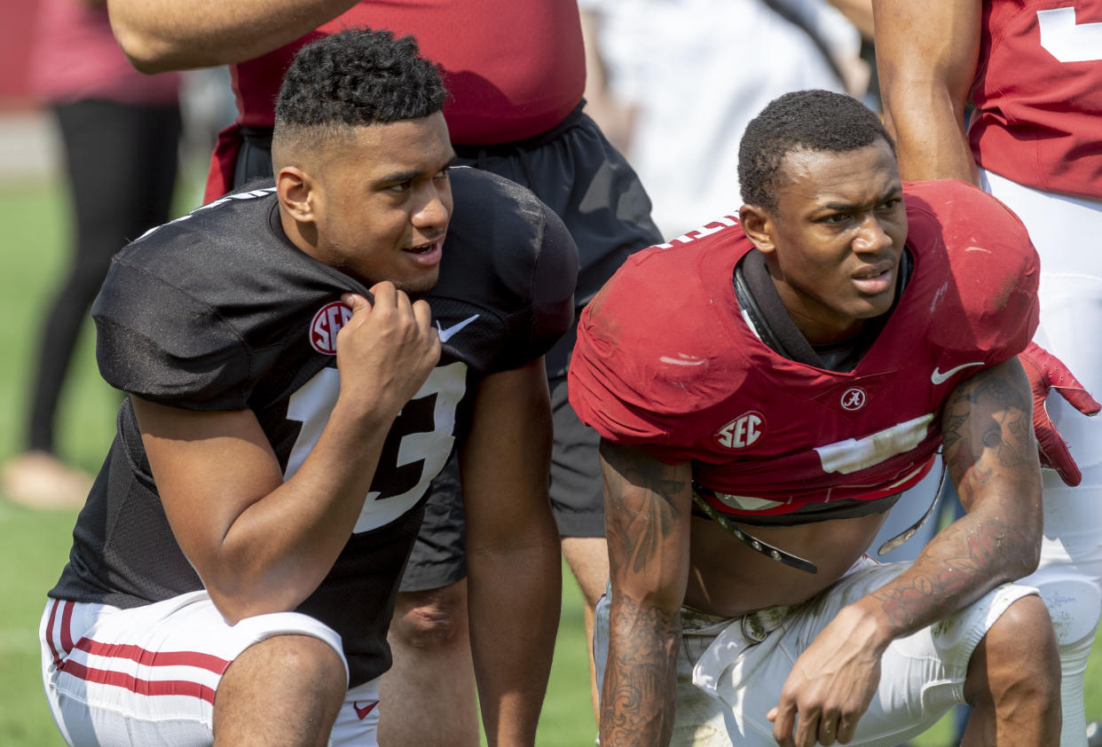 Tua Tagovailoa (13) and DeVonta Smith (6) had a strong bond at Alabama and could continue it in the NFL. (AP Photo/Vasha Hunt)