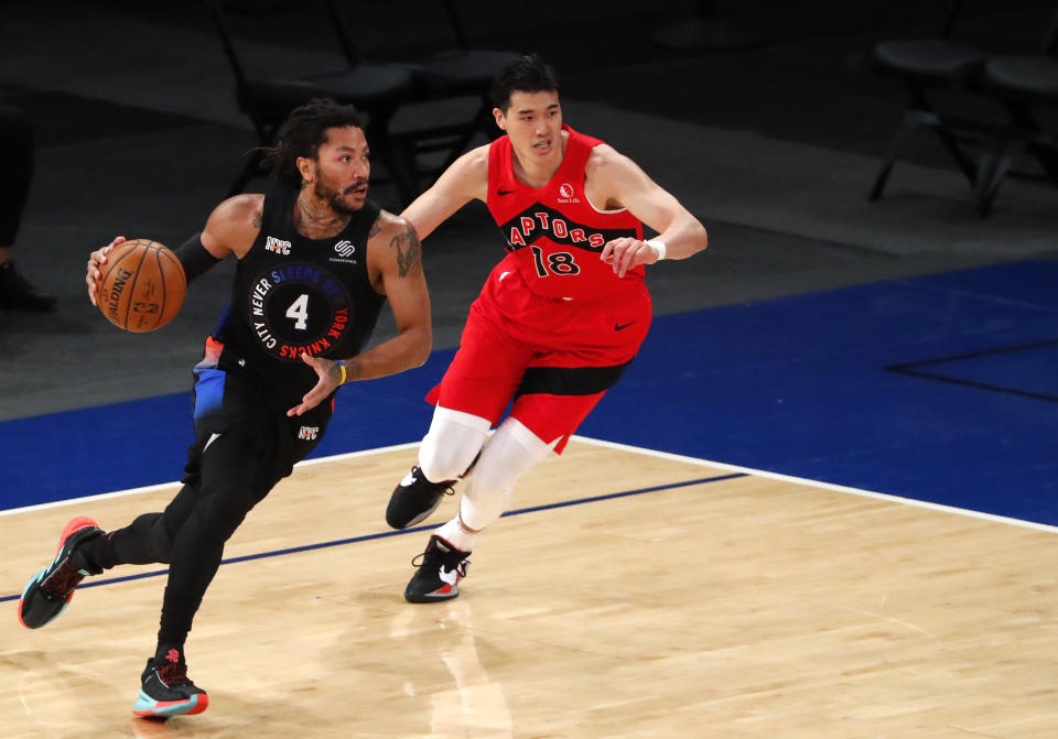 New York Knicks guard Derrick Rose (4) drives to the basket against Toronto Raptors forward Yuta Watanabe (18) during the first half of an NBA basketball game Saturday, April 24,2021, in New York. (AP Photo/Noah K. Murray)