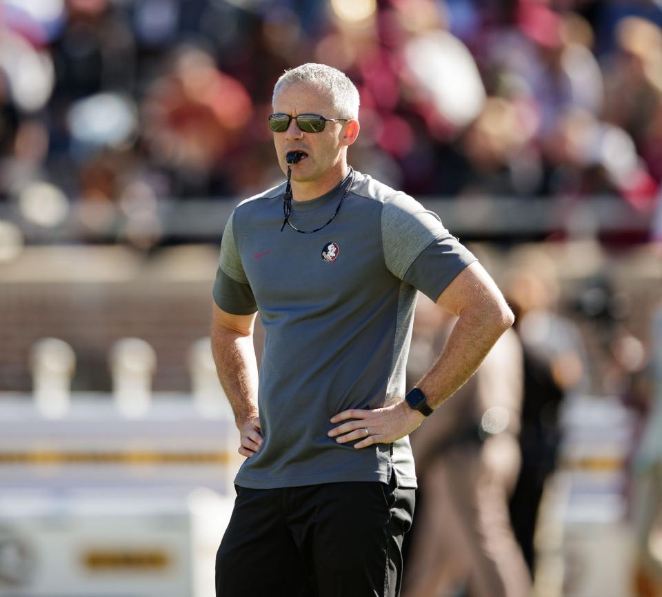 Florida State Seminoles head coach Mike Norvell conducts warm-ups in Doak Campbell Stadium before the Garnet and Gold spring game kickoff Saturday, April 9, 2022.