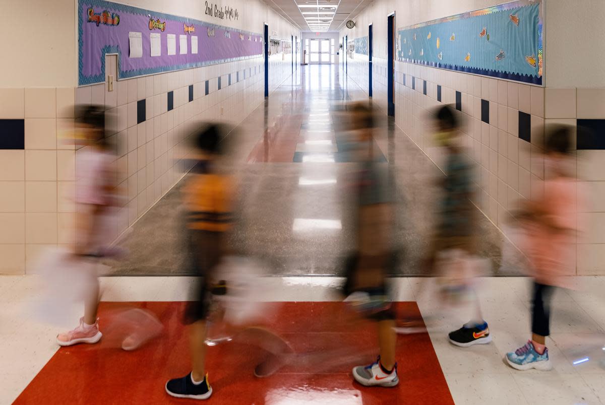 Students and teachers walk between classes at Blanco Vista Elementary School in San Marcos on Aug. 23, 2021.
