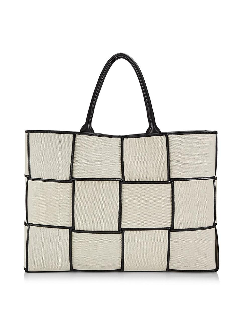 <p><a href="https://go.redirectingat.com?id=74968X1596630&url=https%3A%2F%2Fwww.saksfifthavenue.com%2Fproduct%2Fbottega-veneta-arco-canvas-tote-bag-0400017528139.html&sref=https%3A%2F%2Fwww.harpersbazaar.com%2Ffashion%2Ftrends%2Fg44535857%2Fbest-canvas-tote-bags%2F" rel="nofollow noopener" target="_blank" data-ylk="slk:Shop Now;elm:context_link;itc:0;sec:content-canvas" class="link ">Shop Now</a></p><p>Arco Canvas Tote Bag</p><p>$3300.00</p><p>saksfifthavenue.com</p><span class="copyright">saksfifthavenue.com</span>