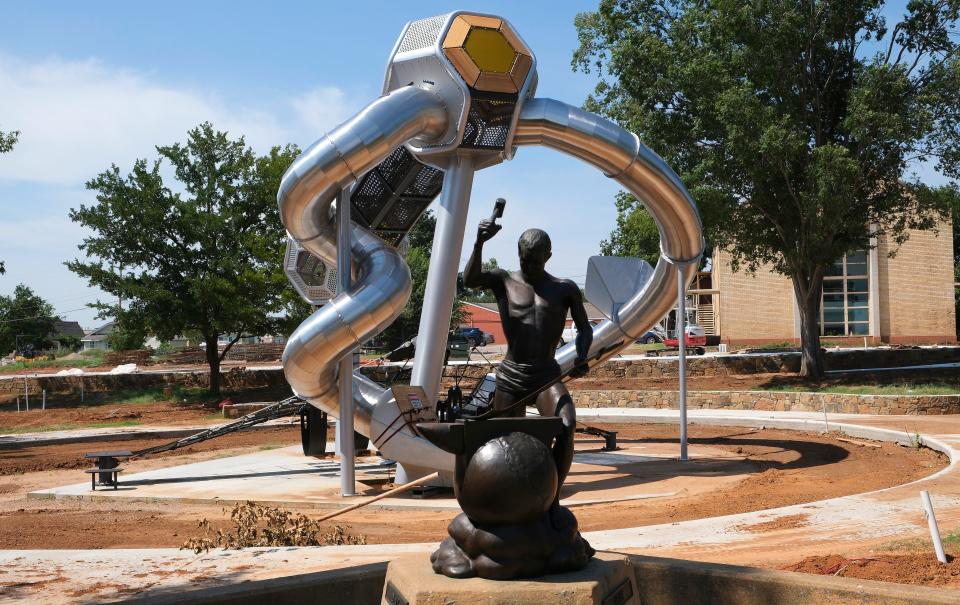 In the foreground is the sculpture by Rich Muno titled "Peace," which was dedicated July 4, 1991. Due to delays in the Stephenson Park renovation project, part of the Edmond park will not be ready to reopen until a later time.