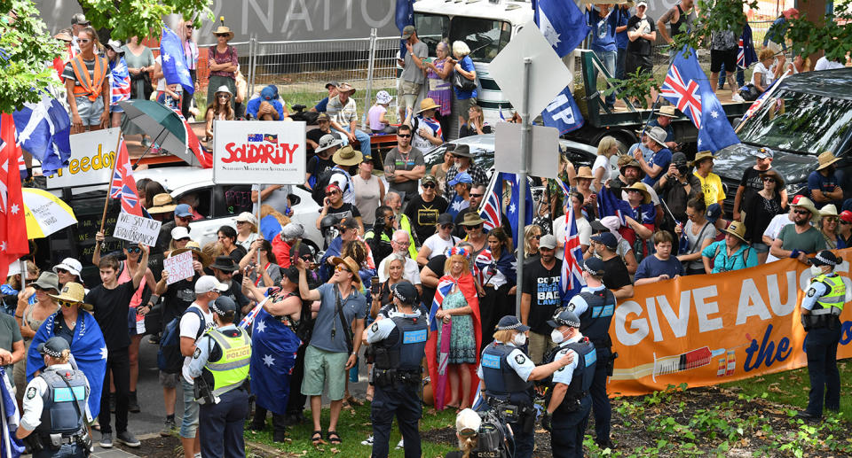 Protesters are seen during an anti-vaccination rally outside the National Press Club of Australia where Prime Minister Scott Morrison will speak in Canberra.