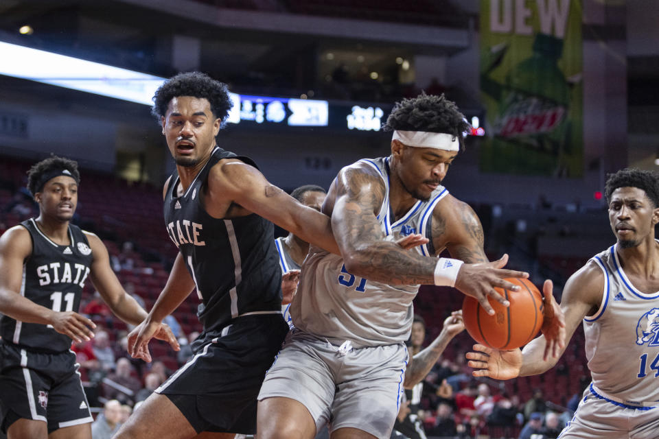 Drake's Darnell Brodie (51) grabs a rebound against Mississippi State's Tolu Smith (1) during the second half of an NCAA college basketball game Tuesday, Dec. 20, 2022, in Lincoln, Neb. (AP Photo/John S. Peterson)