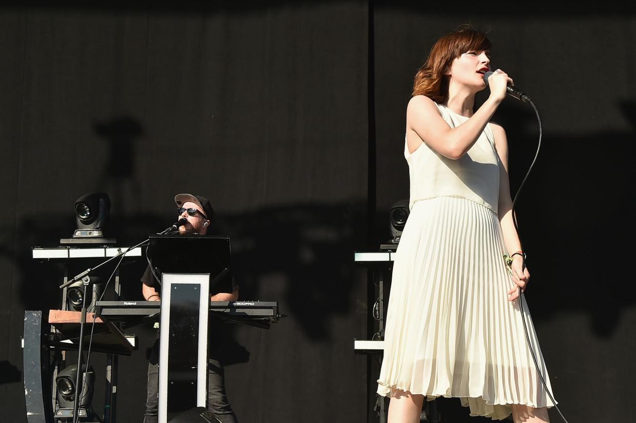 Recording artist Lauren Mayberry (L) and Martin Doherty of Chvrches performs onstage at Firefly Music Festival on June 18, 2016 in Dover, Delaware. Credit: Theo Wargo/Getty Images for Firefly