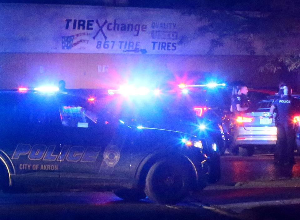 Akron police swarm the area at West Exchange Street and Dodge Avenue Thursday night after group of protesters caravanned from the Ellet area following a protest of the police shooting death of Jayland Walker.