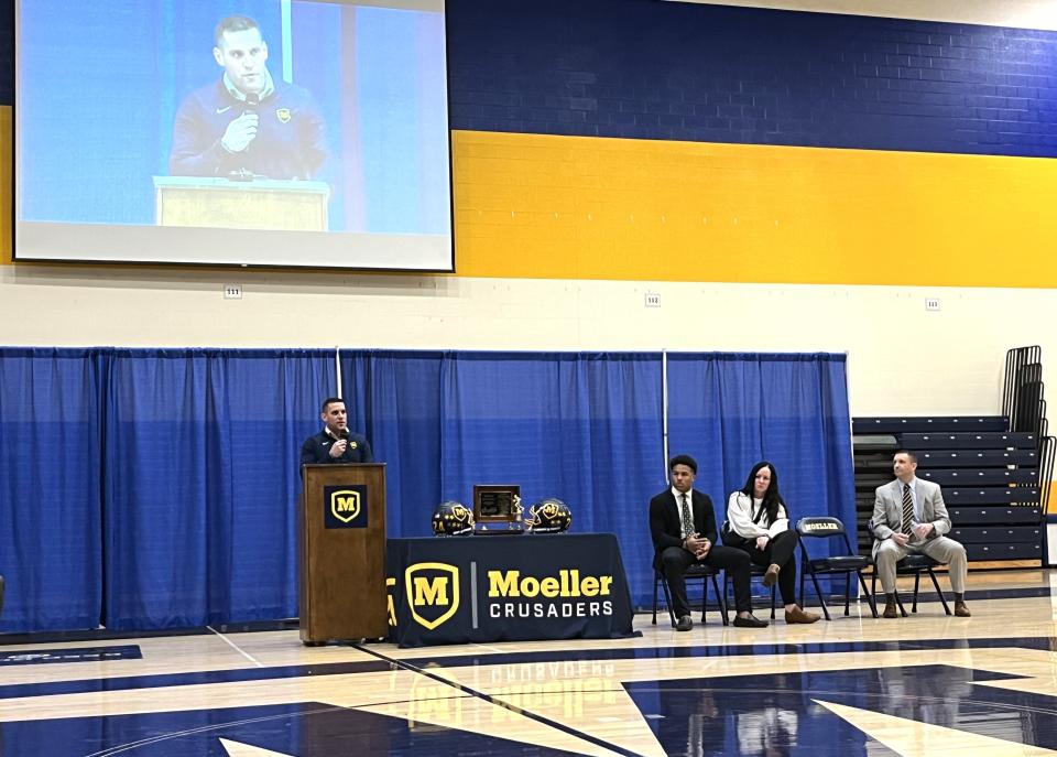 Moeller head coach Bert Bathiany speaks at the assembly as Moeller senior Jordan Marshall was given the trophy for Ohio Mr. Football by the Ohio High School Athletic Assocation Dec. 6, 2023 in the Moeller gymnasium.