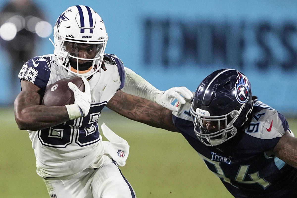 Dallas Cowboys wide receiver CeeDee Lamb (88) is seen with red, white and  blue strips on his helmet in honor of Salute to Service during warms up  before an NFL football game