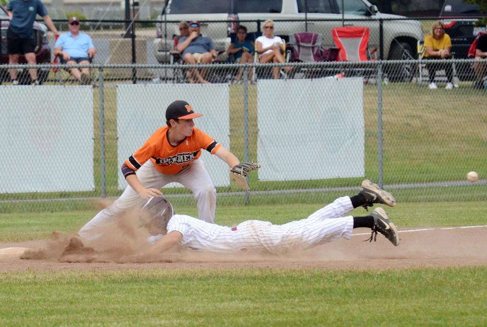 Charlevoix senior Patrick Sterrett gets dirty at third base against Mancelona in the district semi.