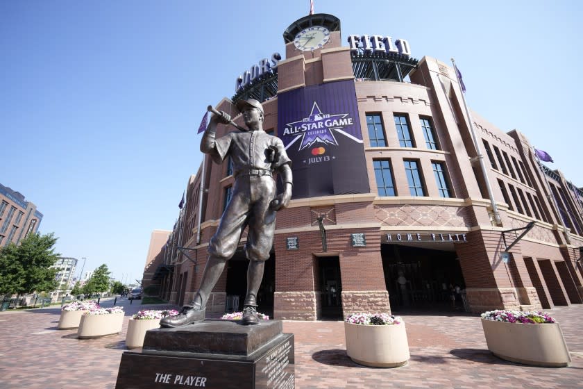 A All Star Game banner hangs from the front entrance of Coors Field behind a sculpture named "The Player" Saturday, July 10, 2021, in Denver. Preparations continue for the playing of Major League Baseball's All Star Game, which is set for Tuesday, July 13, in Coors Field. (AP Photo/David Zalubowski)