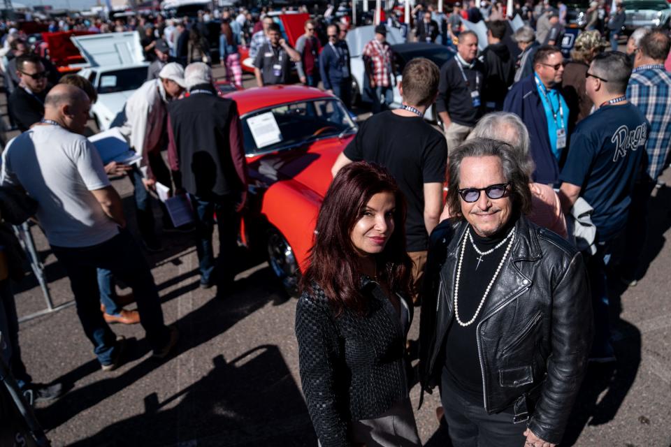 Denise Monti, left, and Jimmy Chase, right, owners of Jewels From Ipanema, pose for a portrait at the Barrett-Jackson Scottsdale Auction held at WestWorld in Scottsdale on January 26, 2024.