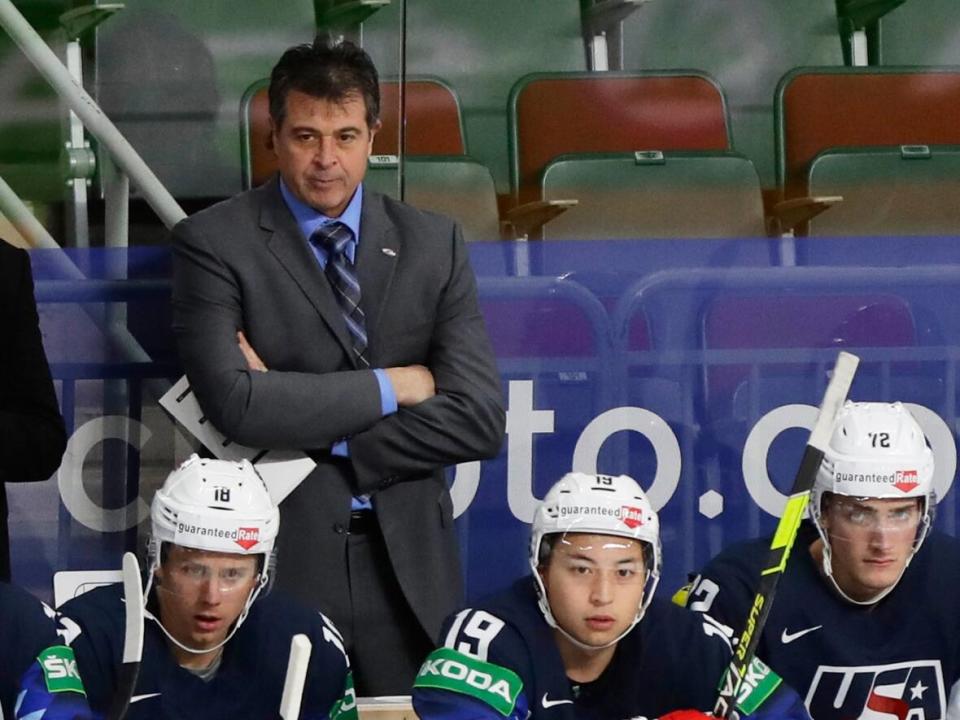 Ottawa Senators associate coach Jack Capuano, seen here coaching the U.S. team this summer, contracted COVID-19 earlier this month. When his fever wouldn't break, he ended up in the emergency room. (Sergei Grits/The Associated Press - image credit)